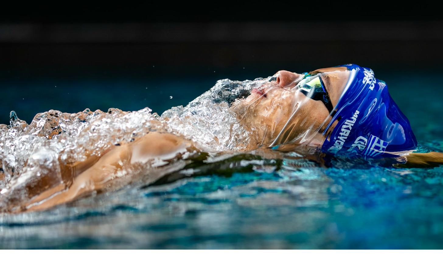 Backstroke swimmer at water level